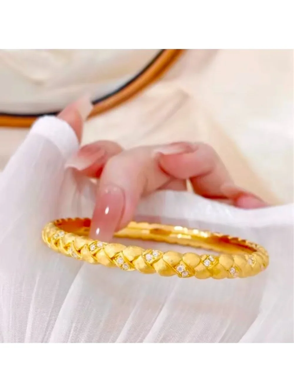 Gold Tone Braided Bangle with Clear Stone Accents
